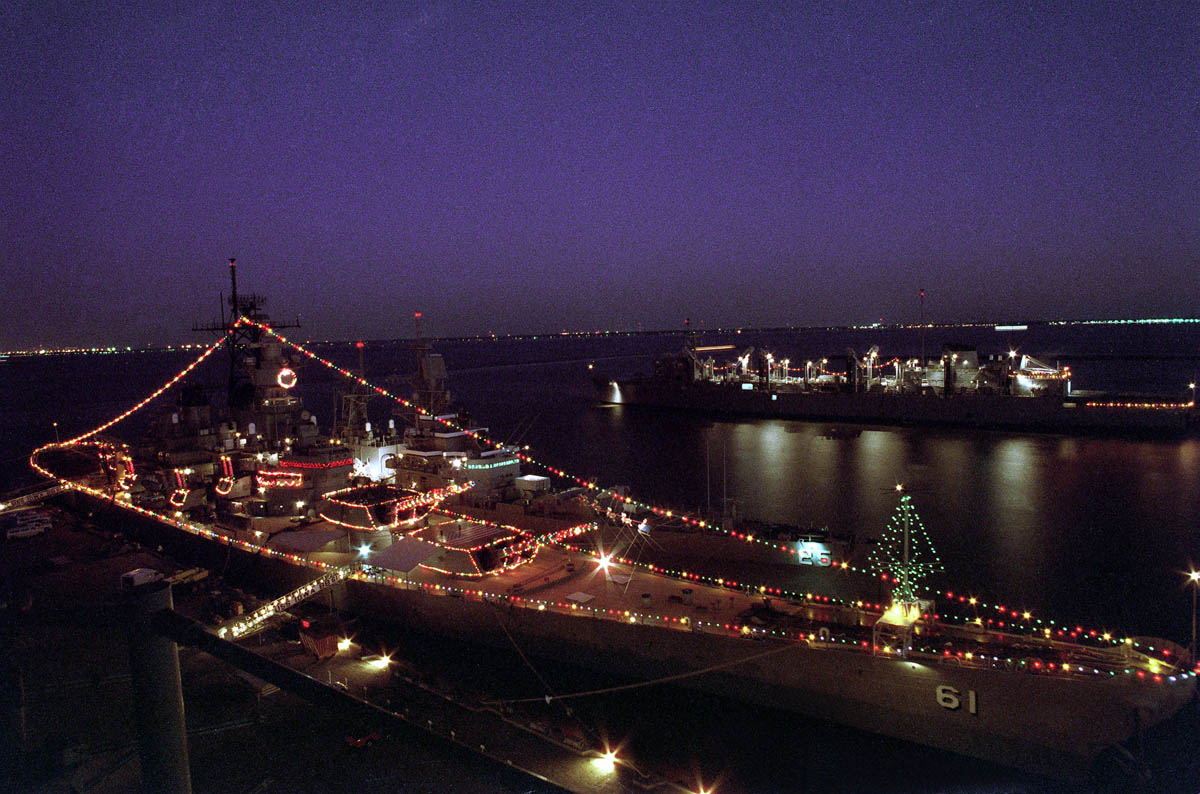 USS IOWA (BB61), decorated with Christmas lights while moored Pier 11, Norfolk Naval Station