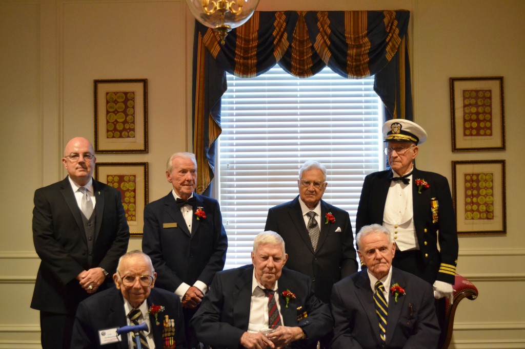 Bottom Row (L to R): LTJG Paul J. Muzychenko, USN (Ret.), MAJ Albert Grasselli, USMC (Ret.), CAPT Jack Crawford, USN (Ret.) Top Row (L to R): GMC Hank Kudzik, USN (Ret.), LCDR Joseph E. Miller, USN (Ret.), CDR Ellis Skidmore, USN (Ret.)