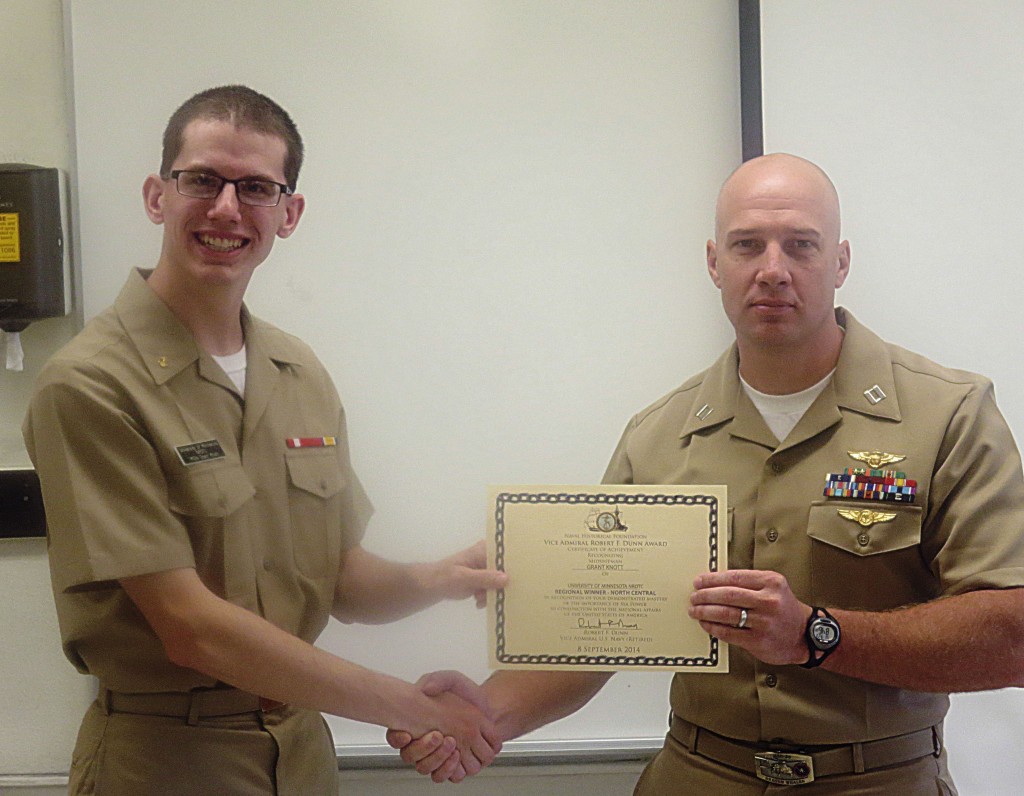 Regional winner Midshipman Knott receiving the award from Devin Bastemeyer. 
