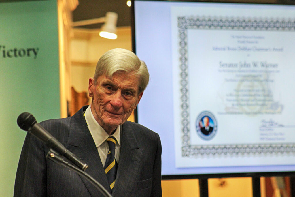 Senator John Warner with the Chairman's Award in the background. (NHF Photo)