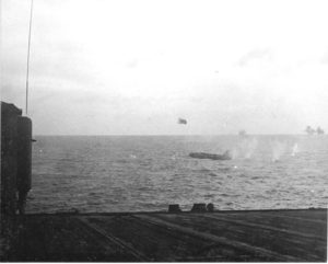 Japanese Betty bomber about to impact the water. (Showing damage to vertical stabilizer from Independence AA fire)